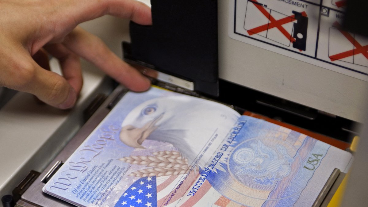State Department Passport Service with a new blank U.S. passport (File).