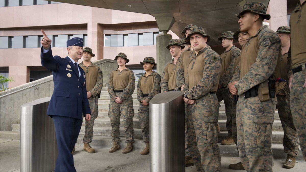 General Dan Caine greets military personnel at the US Embassy in Caracas.