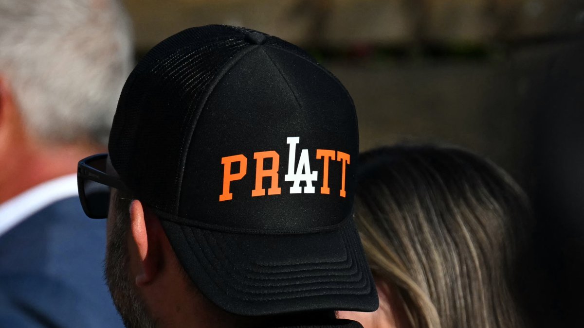 A Spencer Pratt supporter shows off a cap with his name on it
