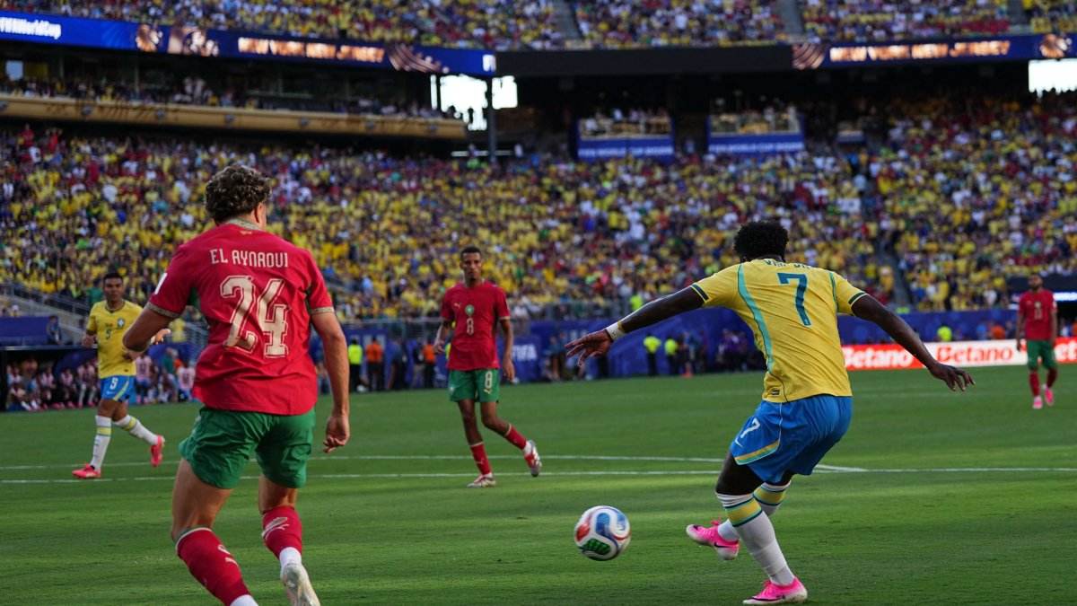 Vinicius Junior (Brazil) scores and celebrates his teams first goal.