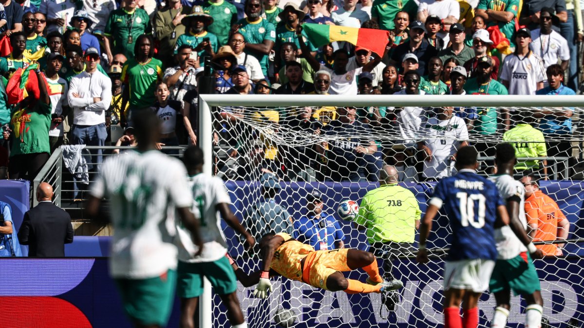 Mbappé (10) scores his second goal against Senegal