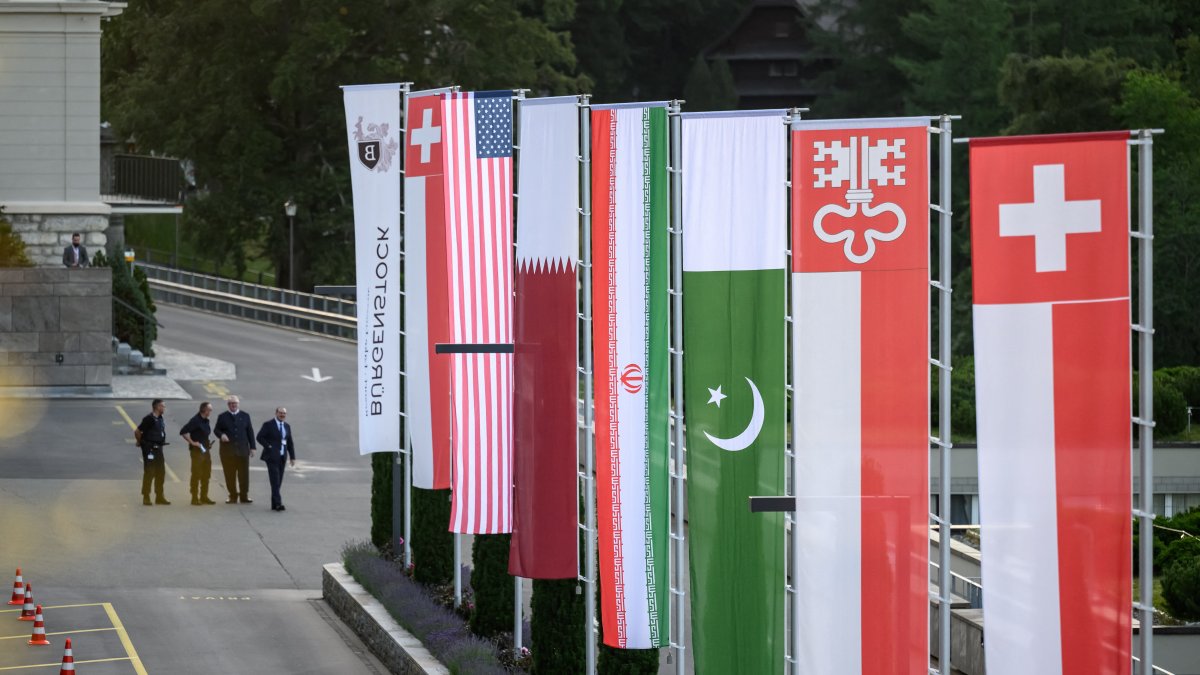 The flags of Switzerland, the United States, Qatar, Pakistan, and the Swiss canton of Nidwalden