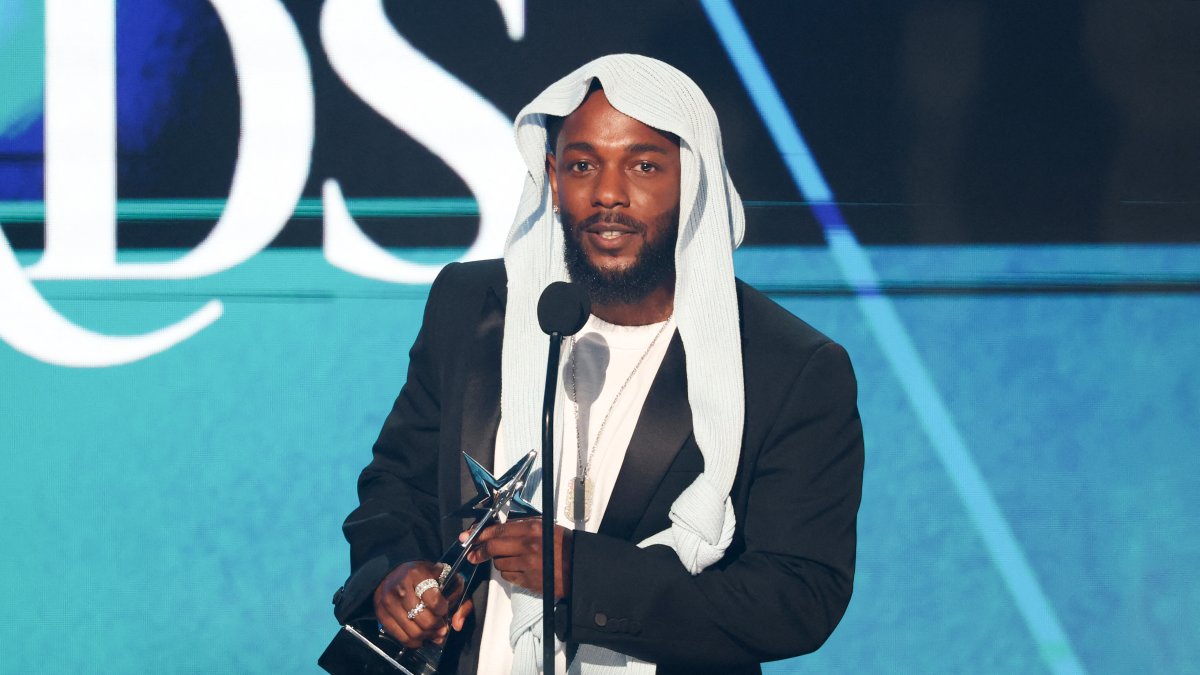Kendrick Lamar with one of his BET Awards