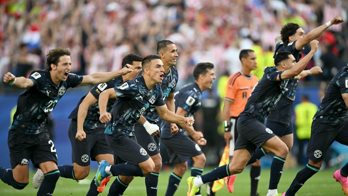 Paraguay’s players celebrate after winning the penalty shootout