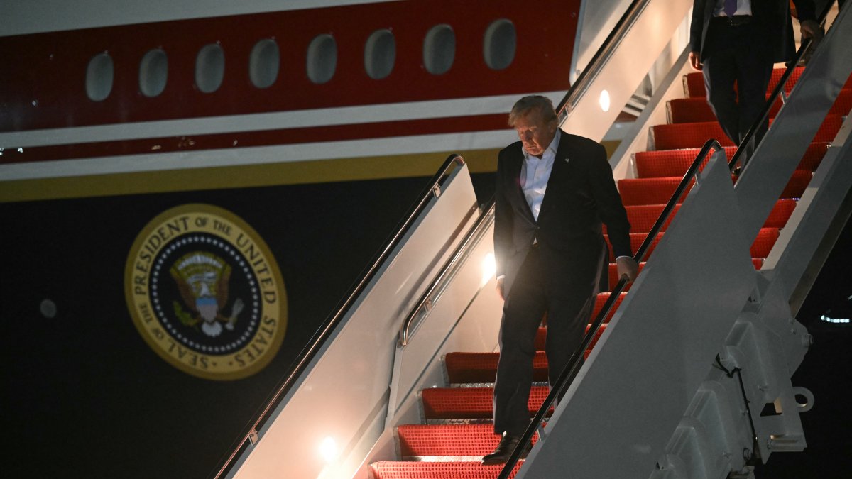 President Donald Trump steps off Air Force One upon his arrival at Joint Base Andrews, Maryland, on July 9, 2026.