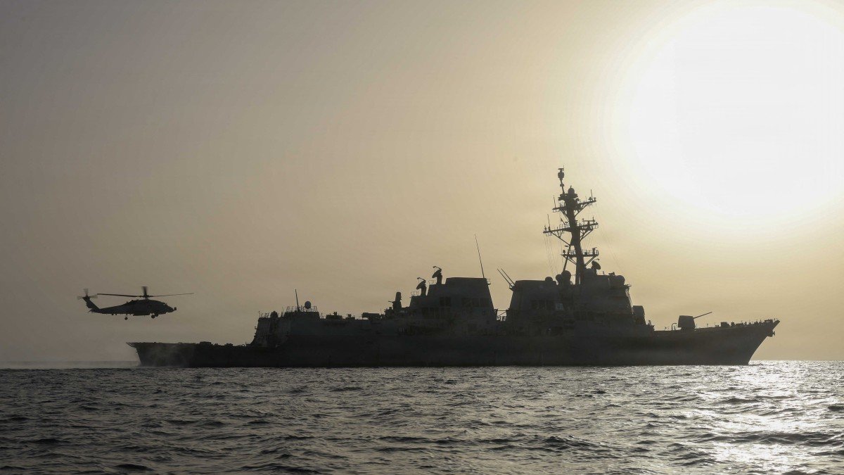 A Sea Hawk helicopter takes off from the destroyer USS Thomas Hudner during operations