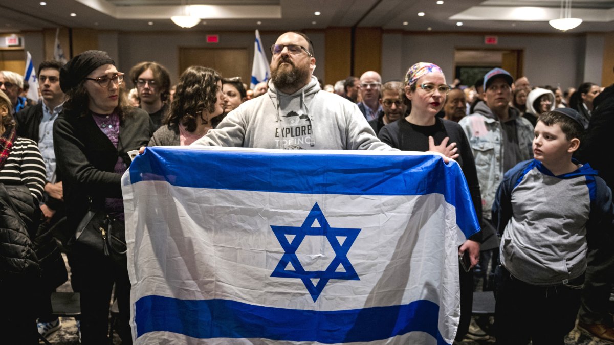 Members of Montreal's Jewish community gather for a vigil at the Gelber Conference Centre