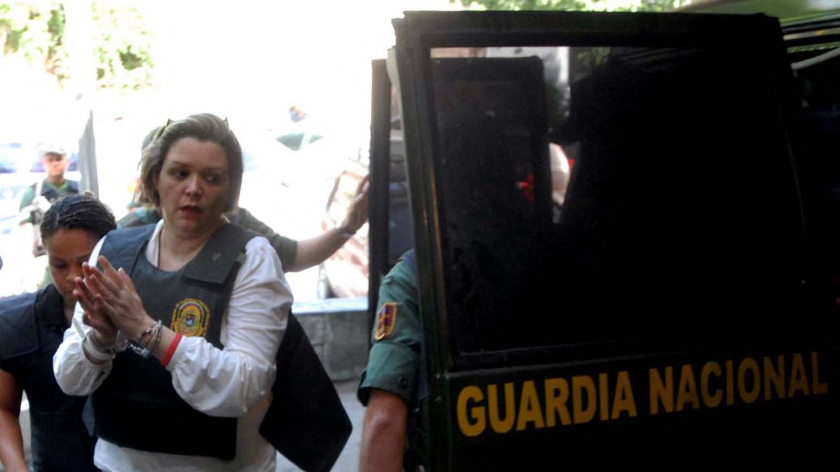 Judge María Lourdes Afiuni arrives under guard at the forensic clinic in Caracas on July 16, 2010.