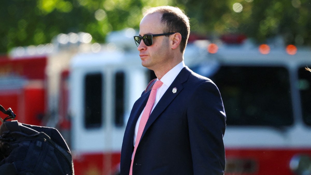 White House Chief of Staff Will Scharf walks toward Marine One