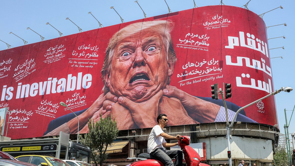 A large billboard pledging revenge against US President Donald Trump along Jomhouri Street in central Tehran