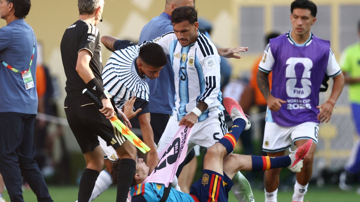 Argentine midfielder Leandro Paredes (above) collides with Spanish midfielder Gavi