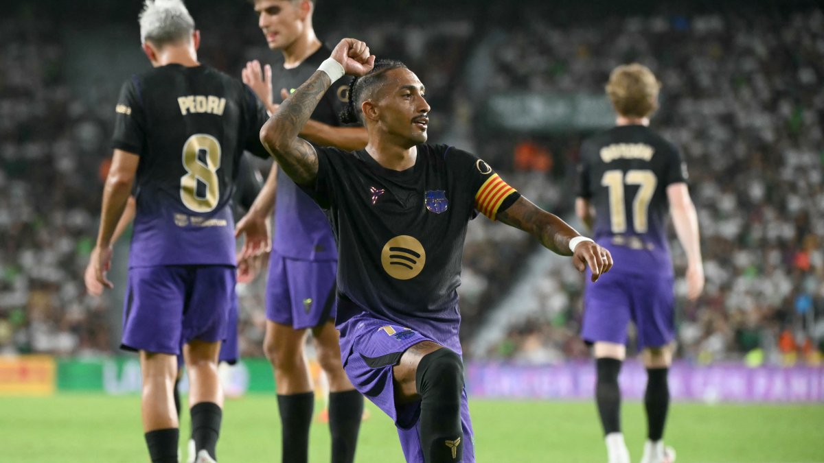 Barcelona's Brazilian forward #11 Raphinha celebrates scoring his team's third goal.
