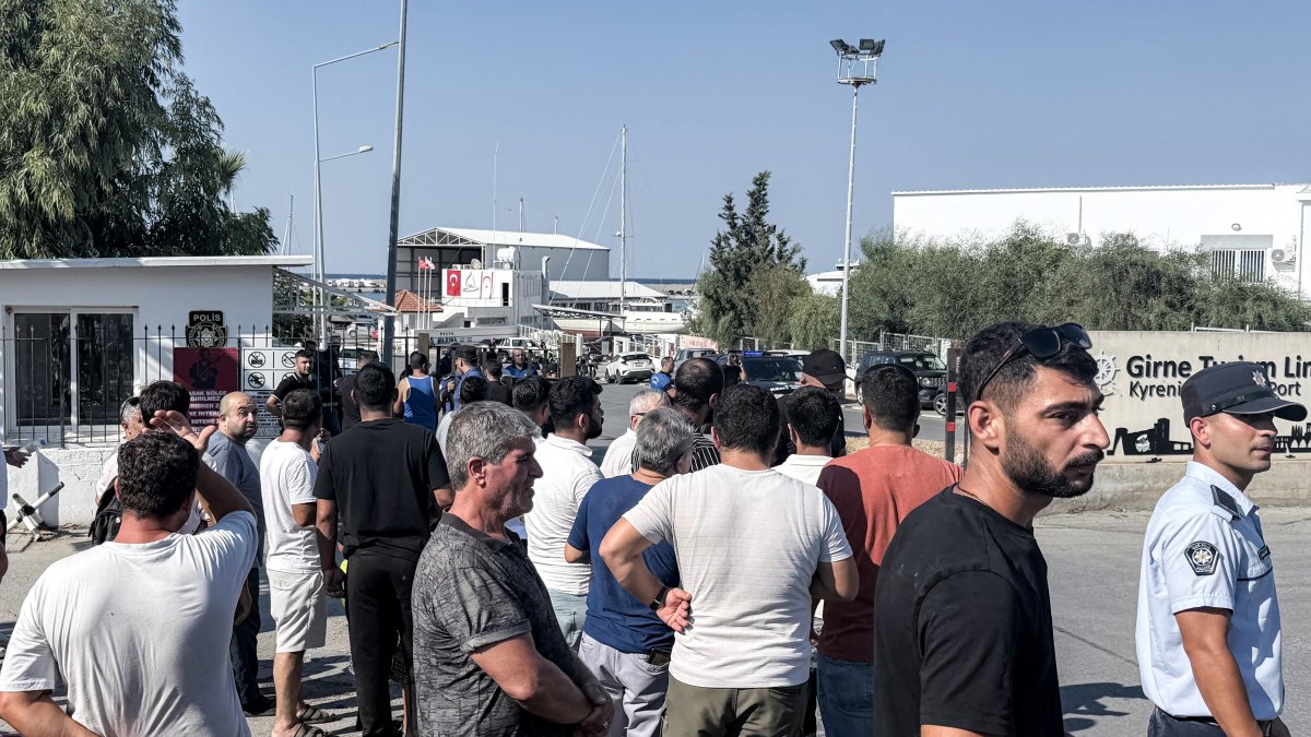 People await news following the sinking of a ferry in the port of Kyrenia, in the self-proclaimed TRNC.
