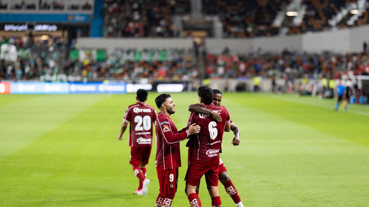 Toluca players celebrate a goal