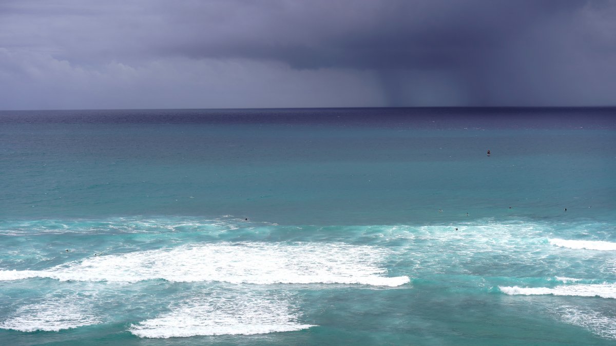 Waves crash off Diamond Head Beach Park in Honolulu, Hawaii