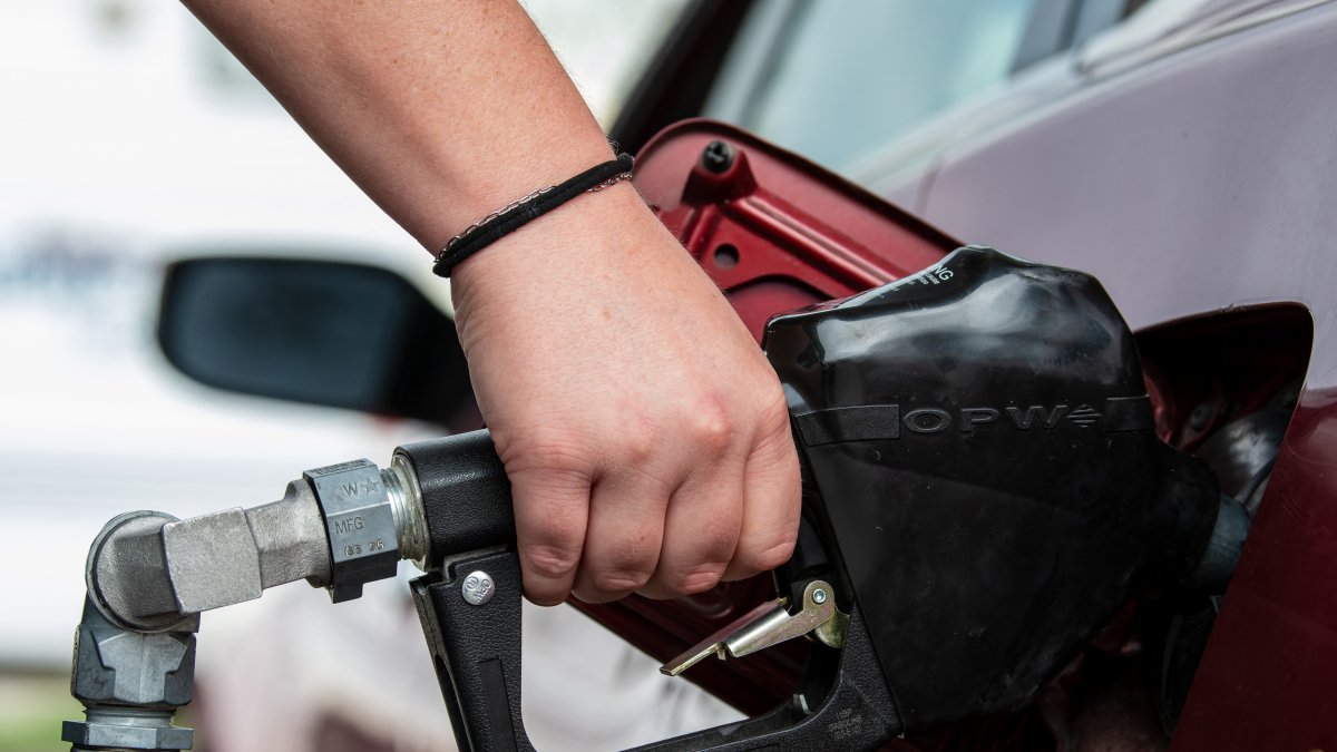 A customer uses a gas pump nozzle to fill a car's tank at a gas station in Santaquin, Utah, on August 31, 2026.
