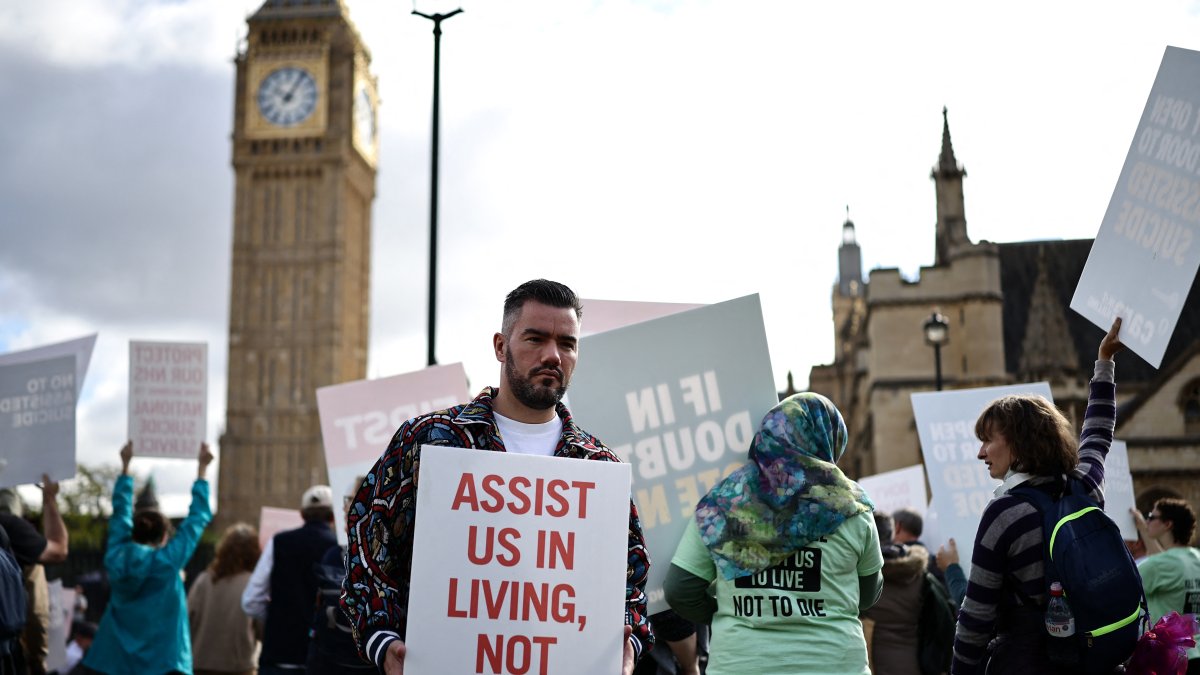 A pro-life activist outside the gates of Westminster