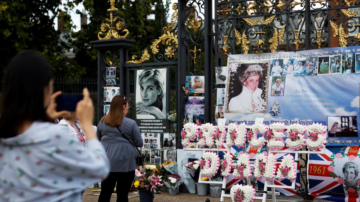 People gather to pay tribute on the anniversary of Princess Diana's death