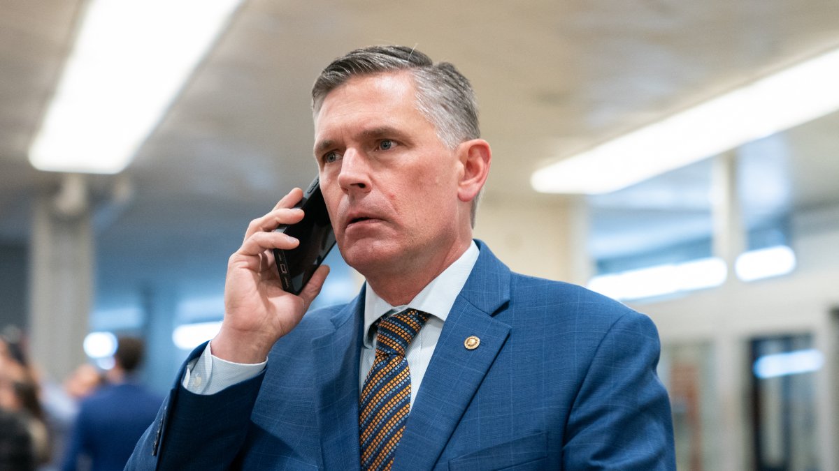 Democratic Senator Martin Heinrich speaks on the phone