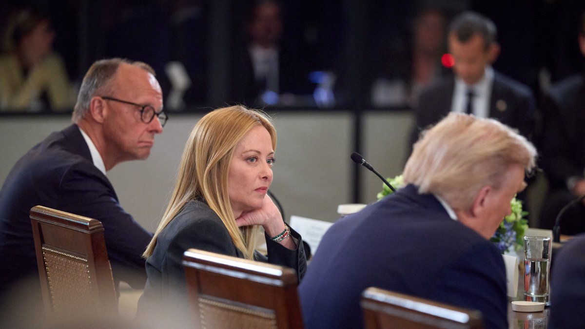 Italian President Giorgia Meloni, seated next to President Donald Trump, at a meeting in Washington in August 2025.