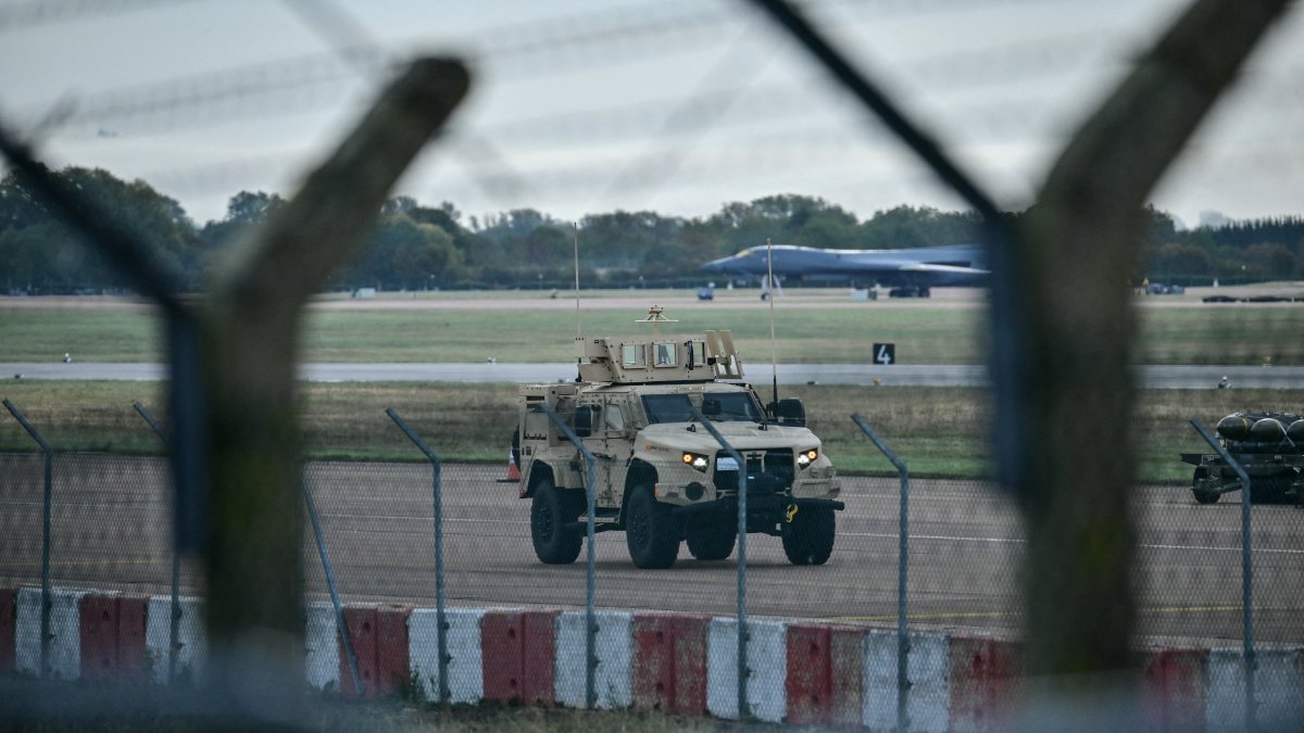 An armored vehicle patrols inside the Fairford base