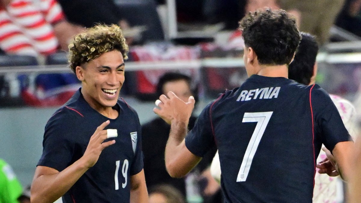 Hall (left) celebrates a goal with Gio Reyna