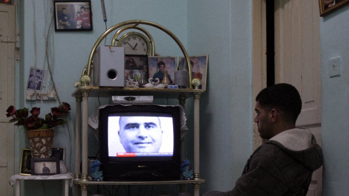 A relative of Nidal Malik Hasan sees him on the news in a file photo