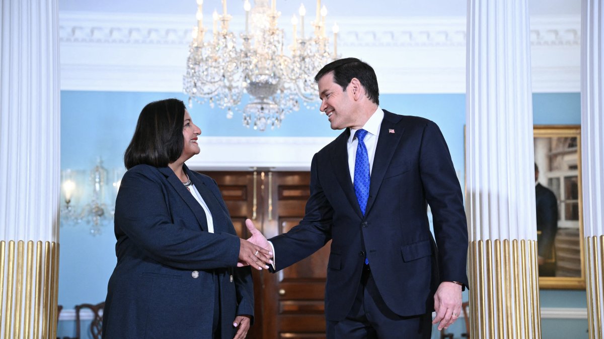 Secretary of State Marco Rubio shakes hands with Venezuelan opposition leader Dinorah Figuera