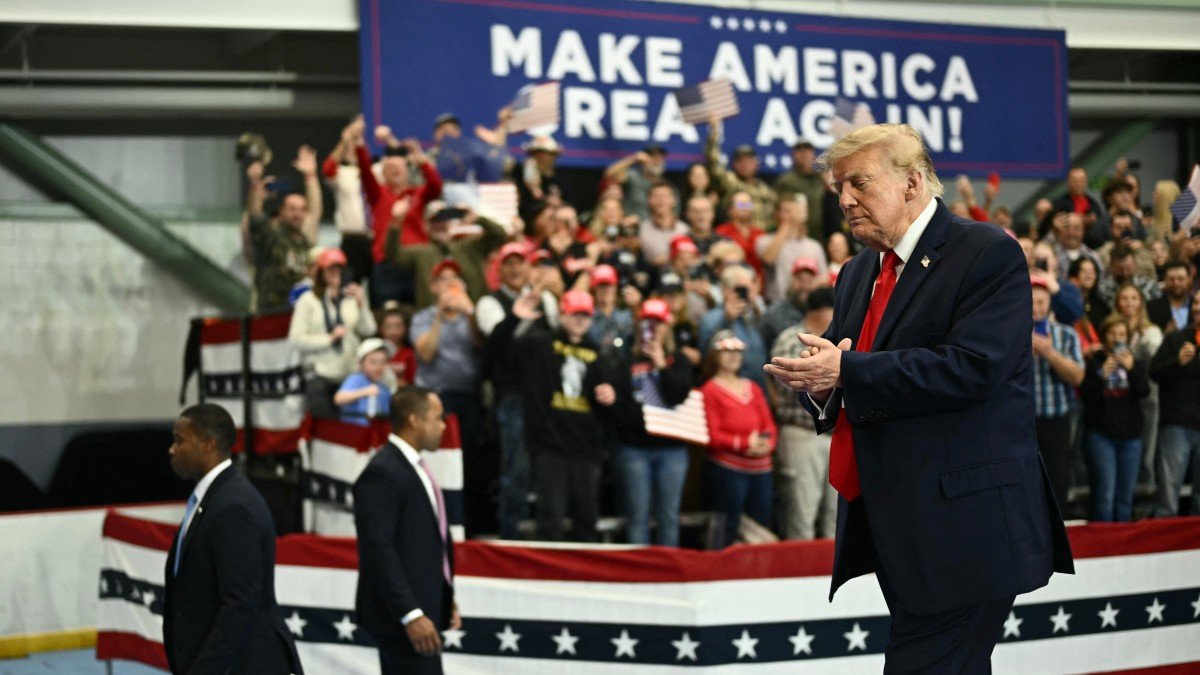 Donald Trump applauds as he leaves the stage after speaking at a campaign rally in Alaska