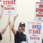 Union members react as Aerospace Machinists District 751 President Jon Holden (out of frame) announces that union members rejected a proposed Boeing contract and will go on strike, following voting results at their union hall in Seattle, Washington, on September 12, 2024. - Boeing workers in the Seattle region overwhelmingly voted to strike on September 12, rejecting a contract the embattled aviation giant characterized as a boon for staff given the company's stressed financial condition. (Photo by Jason Redmond / AFP)