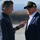 US President Donald Trump and First Lady Melania Trump are greeted by California Governor Gavin Newsom upon arrival at Los Angeles International Airport in Los Angeles, California, on January 24, 2025, to visit the region devastated by the Palisades and Eaton fires. (Photo by Mandel NGAN / AFP)