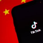 TikTok with the Chinese flag in the backgro