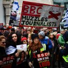 Protesters hold placards and wave Israeli flags as they take part in a demonstration "Rape is NOT resistance" outside the BBC headquarters, in London, on February 4, 2024 to bring attention to the plight of the kidnapped Israeli women in Gaza who have been held by Hamas for over 110 days. Thousands of civilians, both Palestinians and Israelis, have died since October 7, 2023, after Palestinian Hamas militants based in the Gaza Strip entered southern Israel in an unprecedented attack triggering a war declared by Israel on Hamas with retaliatory bombings on Gaza. (Photo by HENRY NICHOLLS / AFP)