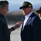 US President Donald Trump and First Lady Melania Trump are greeted by California Governor Gavin Newsom upon arrival at Los Angeles International Airport in Los Angeles, California, on January 24, 2025, to visit the region devastated by the Palisades and Eaton fires. (Photo by Mandel NGAN / AFP)