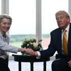 US President Donald Trump (R) shakes hands with European Commission President Ursula von der Leyen (L) after agreeing on a trade deal between the two economies following their meeting, in Turnberry south west Scotland on July 27, 2025, on the third day of his visit to the country, since his second tenure as President began. US President Donald Trump said on July 27, 2025 that he had reached a trade agreement with European Union chief Ursula von der Leyen. "We have reached a deal. It's a good deal for everybody," Trump told reporters after talks with von der Leyen at his golf resort in Turnberry, Scotland. The EU chief also hailed it as a "good deal". (Photo by Brendan SMIALOWSKI / AFP)
