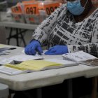 October 26, 2020, Lawrenceville, Georgia, USA: Absentee ballot processing could begin GeorgiaÃs counties15 days before Election Day and can continue by state law until November 13. After the information on the outer envelop is verified, the ballots are bundled together for processing. This next steps include opening the outer envelope, removing the ballot from the secrecy sleeve, separating the envelopes from the ballots, and counting to make sure that the total number of ballots and envelopes are the same. (Credit Image: © Sue Dorfman/ZUMA Wire)