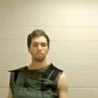 This screengrab from the Utah Court live streaming shows Tyler Robinson, the suspect in the killing of political activist Charlie Kirk, attending a court appearance remotely from his jail cell in Provo, Utah, on September 16, 2025. Robinson has been formally charged with the murder of Kirk, and the prosecution added a notice of intent to seek the death penalty. Six other charges include obstruction of justice and witness tampering. Kirk, a close ally of President Donald Trump, was shot dead last week during a speaking event on a Utah university campus. (Photo by POOL / AFP)
