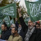Protesters hold Palestinian militant group Hamas flags
