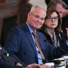 ExxonMobil CEO Darren Woods (C) attends a meeting with US President Donald Trump and oil company executives in the East Room of the White House in Washington, DC on January 9, 2026. President Trump is aiming to convince oil executives to support his plans in Venezuela, a country whose energy resources he says he expects to control for years to come. US forces seized Venezuelan president Nicolas Maduro in a sweeping military operation on January 3, with Trump making no secret that control of Venezuela's oil was at the heart of his actions. (Photo by Brendan SMIALOWSKI / AFP)