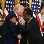 US President Donald Trump shakes hands with Leo Terrell