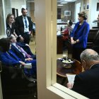 US Senate Minority Leader Chuck Schumer (lower R), Democrat from New York, huddles with Senate Democrats before a news conference