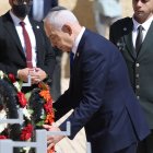 Israel's Prime Minister Benjamin Netanyahu bows attends a wreath-laying ceremony marking the annual Holocaust Remembrance Day