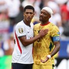 England's midfielder #10 Jude Bellingham (L) reacts with Ghana's forward #09 Jordan Ayew during the 2026 World Cup Group L football match between England and Ghana at the Boston Stadium in Foxborough on June 23, 2026.  (Photo by CHARLY TRIBALLEAU / AFP)