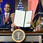 US President Donald Trump displays an executive order on artificial intelligence