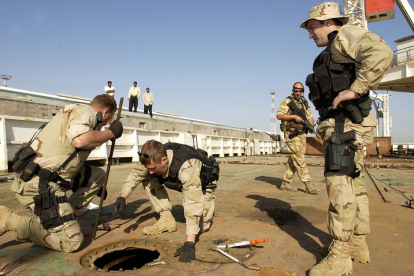 Operators search for smuggled crude oil during the invasion of Iraq.