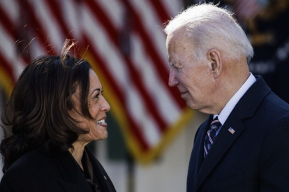 President Joe Biden exchanges words with Vice President Kamala Harris during a reception.
