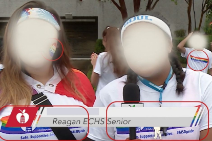 Students wearing T-shirts and stickers with the name of the district and the colors of the LGBT flag. (Voz Media / Vimeo: AISD.TV)