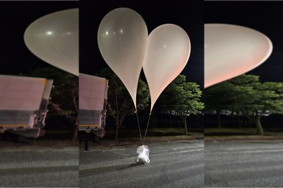 This photo taken by South Korea's Defense Ministry between the night of May 28 and 29, 2024, and released on May 29, shows unidentified objects believed to be North Korean propaganda material tied to balloons in a Chungnam province street. North Korea launched alleged anti-South Korean