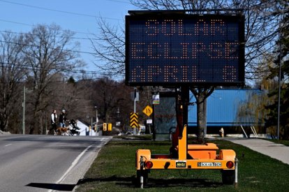 The rotating message on a digital sign advises people to expect traffic delays, one day before a total solar eclipse will be visible in Kingston, Ont., Sunday, April 7, 2024.
