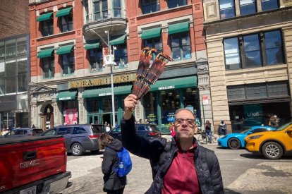 Businessman selling eclipse sunglasses in Union Square, New York, on Sunday, April 7, 2024.